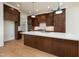 Stunning kitchen featuring a large island, custom cabinets, and modern lighting fixtures at 8624 Dukes Lake Rd, Zebulon, NC 27597