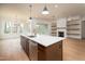Kitchen island with stone countertops, stainless steel dishwasher, and pendant lighting at 8624 Dukes Lake Rd, Zebulon, NC 27597