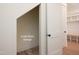 Under stairs storage area with brick floors and white trim at 8624 Dukes Lake Rd, Zebulon, NC 27597