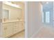 Beautiful bathroom featuring double sinks, white cabinetry, and modern fixtures at 140 Norwell Ln, Pittsboro, NC 27312