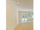 Bright and airy living area features hardwood floors, recessed lighting, and windows letting in natural light at 140 Norwell Ln, Pittsboro, NC 27312