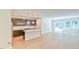 Open concept living space featuring modern kitchen and hardwood floors leading to bright living area at 140 Norwell Ln, Pittsboro, NC 27312
