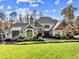 Beautiful home with stone and shingle accents, expansive lawn at 110 Bywater Way, Chapel Hill, NC 27516
