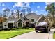 Luxury home with circular driveway and landscaping; Rolls Royce present at 110 Bywater Way, Chapel Hill, NC 27516