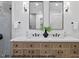 A modern bathroom features dual sinks, vanity with natural-look wood, black accents, and a glass shower stall at 1306 Lennox Pl, Raleigh, NC 27612