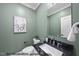 Elegant half bathroom with marble countertop and neutral decor at 1306 Lennox Pl, Raleigh, NC 27612