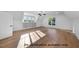Bonus room with hardwood floors, large window, and recessed lighting at 1306 Lennox Pl, Raleigh, NC 27612