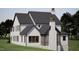 Elegant exterior elevation showcasing a white brick chimney and a well-manicured lawn at 1306 Lennox Pl, Raleigh, NC 27612