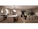 Open-concept kitchen and dining area with a large island, stainless steel appliances, and modern lighting at 1306 Lennox Pl, Raleigh, NC 27612