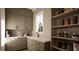 Charming kitchen featuring a marble countertop, shaker cabinets, and a convenient pantry space at 1306 Lennox Pl, Raleigh, NC 27612
