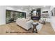 A spacious living room featuring a fireplace, open shelving, modern furniture, and sliding glass doors to the exterior at 1306 Lennox Pl, Raleigh, NC 27612