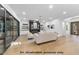 An open-concept living room shows off a fireplace with open shelving, modern furniture, and hardwood floors at 1306 Lennox Pl, Raleigh, NC 27612