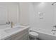 This white bathroom features a shower and bathtub combination, and a vanity sink at 25 Basil Ct, Franklinton, NC 27525