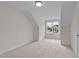 Bedroom featuring a large window, neutral color palette, and carpeted flooring at 25 Basil Ct, Franklinton, NC 27525