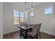 Dining nook featuring transitional chandelier and natural light from multiple windows at 25 Basil Ct, Franklinton, NC 27525