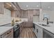 Kitchen with marble backsplash, stainless steel appliances, sink, and granite countertop at 25 Basil Ct, Franklinton, NC 27525