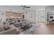 Open floor plan with a living room, kitchen, hardwood floors, a fireplace and modern décor at 25 Basil Ct, Franklinton, NC 27525