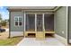 Back porch with stairs, outdoor view, and screened in area at 25 Basil Ct, Franklinton, NC 27525