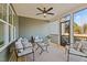 Covered porch with comfortable seating, ceiling fan, and serene ambiance at 25 Basil Ct, Franklinton, NC 27525