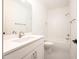 Clean bathroom with a white vanity, large mirror, shower, and tub with white tile at 1226 Red Cedar Ct, Youngsville, NC 27596