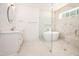 Luxurious bathroom with a soaking tub, walk-in shower, and stylish vanity at 1226 Red Cedar Ct, Youngsville, NC 27596