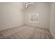 Carpeted bedroom with white walls and trim, a ceiling fan, and natural light from a window at 1226 Red Cedar Ct, Youngsville, NC 27596
