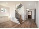Bright and airy foyer with plank floors, a decorative door, modern lighting and built-in cabinets at 1226 Red Cedar Ct, Youngsville, NC 27596