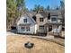Beautiful two-story home with brick and siding, a gray roof, and professionally landscaped front yard at 1226 Red Cedar Ct, Youngsville, NC 27596