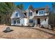 Charming two-story home featuring a mix of brick and siding, complemented by an expansive lawn at 1226 Red Cedar Ct, Youngsville, NC 27596