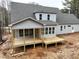 Gray house with a large deck and screened porch at 1226 Red Cedar Ct, Youngsville, NC 27596