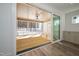 Outdoor patio features a wood floor and a view of the snowy landscape, with an open sliding door to the interior at 1226 Red Cedar Ct, Youngsville, NC 27596