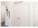 Laundry room with double doors and decorative wall hangings at 161 Deodora Ln, Cameron, NC 28326