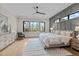 Cozy bedroom with stylish grey accent wall, contemporary furniture, and a scenic view at 30 Hartwood Ln, Youngsville, NC 27596