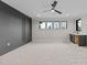 Large bonus room with carpet, accent wall, wet bar, recessed lighting, and natural light at 30 Hartwood Ln, Youngsville, NC 27596