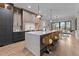 Open-concept kitchen with a large island, pendant lights, stainless steel appliances, and seamless flow to dining area at 30 Hartwood Ln, Youngsville, NC 27596