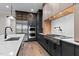 Gourmet kitchen featuring stainless steel appliances, double ovens, a range, custom cabinets, and hardwood flooring at 30 Hartwood Ln, Youngsville, NC 27596