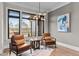 Inviting sitting area with comfortable chairs, a stylish table, and a view of the outdoors at 30 Hartwood Ln, Youngsville, NC 27596
