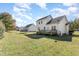 Two-story house with deck, grassy yard, and trampoline at 106 Keeneland Dr, Oxford, NC 27565