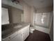 Bathroom with granite vanity, single sink, and bathtub at 48 Silver Ct, Smithfield, NC 27577