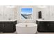 Large bathroom with double vanity and soaking tub at 530 Germaine St, Apex, NC 27502