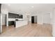 Open concept kitchen with island and barn door at 530 Germaine St, Apex, NC 27502