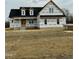 Newly constructed craftsman style home with a wrap around porch at 5601 River Buck Rd, Spring Hope, NC 27882