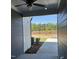 Cozy covered back porch showcases a view of the outdoors and potential for relaxing outdoor living at 937 Alma Railway Dr # 555, Wake Forest, NC 27587