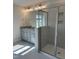 Elegant bathroom features a granite vanity, framed mirror, and a glass-enclosed tiled shower at 937 Alma Railway Dr # 555, Wake Forest, NC 27587