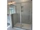 Modern bathroom features a glass-enclosed tiled shower with built-in shelves and sleek hardware at 937 Alma Railway Dr # 555, Wake Forest, NC 27587
