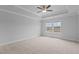 Bright bedroom featuring a tray ceiling, a ceiling fan and natural light from large windows at 937 Alma Railway Dr # 555, Wake Forest, NC 27587
