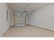 Empty two car garage with the garage door in the open position and concrete flooring at 937 Alma Railway Dr # 555, Wake Forest, NC 27587