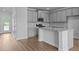 A kitchen featuring gray cabinets, granite countertops, and stainless steel appliances at 937 Alma Railway Dr # 555, Wake Forest, NC 27587