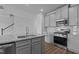 Kitchen with gray cabinets, granite countertops, and stainless steel appliances at 937 Alma Railway Dr # 555, Wake Forest, NC 27587