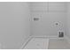 A laundry room with a utility sink, washer/dryer hookups and shelving unit at 937 Alma Railway Dr # 555, Wake Forest, NC 27587